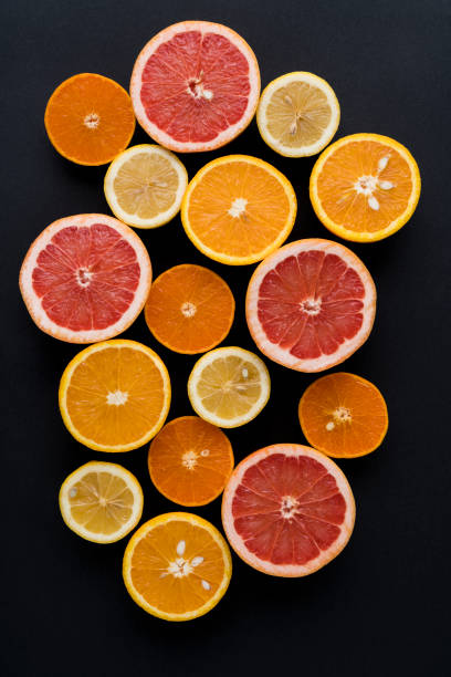 istock Orange, Grapefruit, Mandarine And Lemon Fruit On Black Background 1127576065