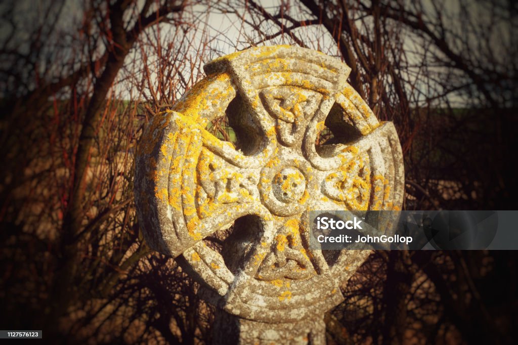 Cornish Celtic Cross A typical lichen covered Celtic Cross found in many Cornish churchyards, Gunwalloe, Cornwall, UK Carving - Craft Product Stock Photo