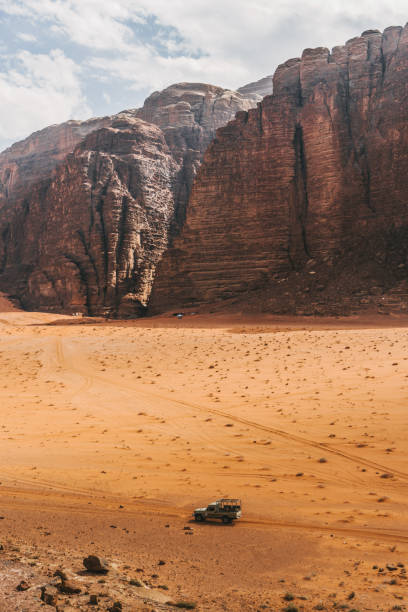 istock Scenic view of SUV in Wadi Rum desert 1127576854