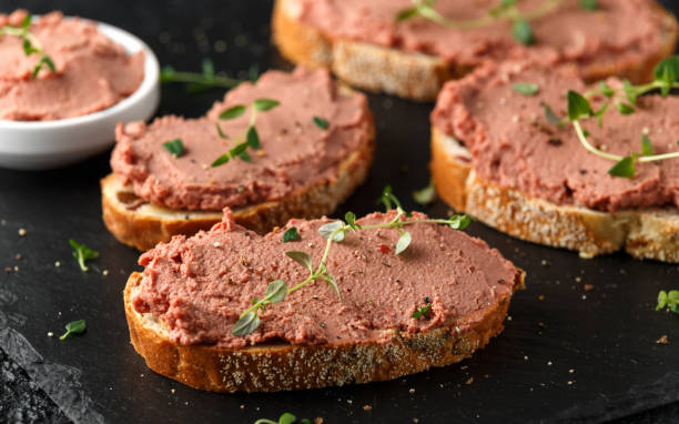 istock Fresh homemade chicken liver pate on bread 1127577042
