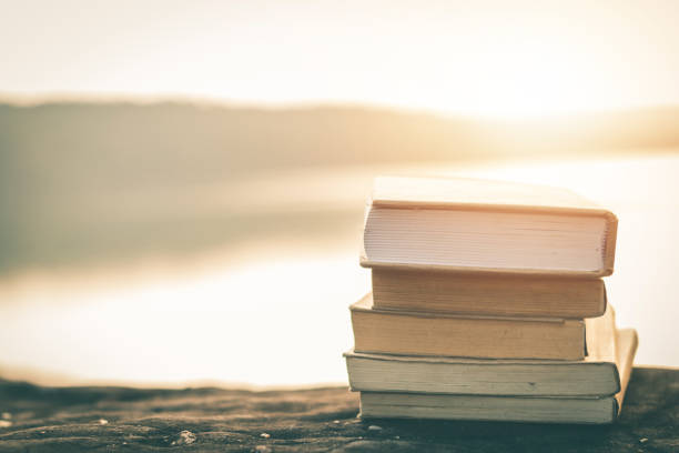 istock Stack Of Books On Table Outdoors 1127578339