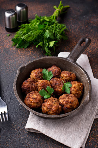 istock Homemade beef meatballs in frypan 1127579162