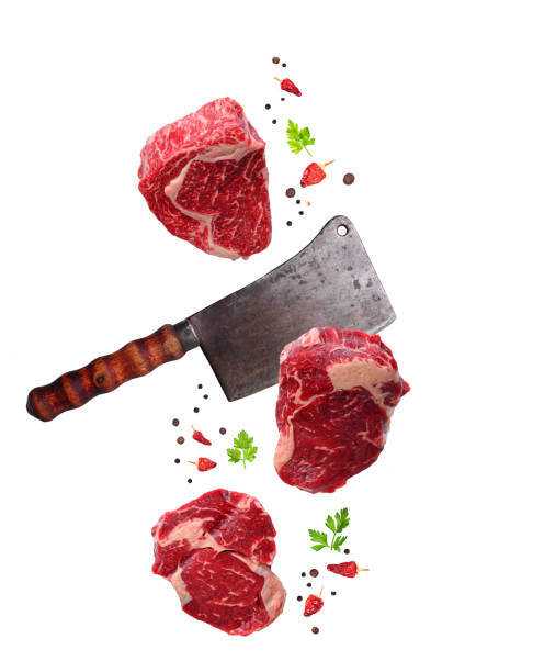 分離された生霜降りリブロース ステーキと肉屋のナイフ - beef meat food freshness ストックフォトと画像