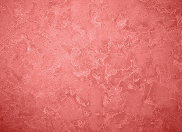 istock Living coral textured concrete background 1127579392