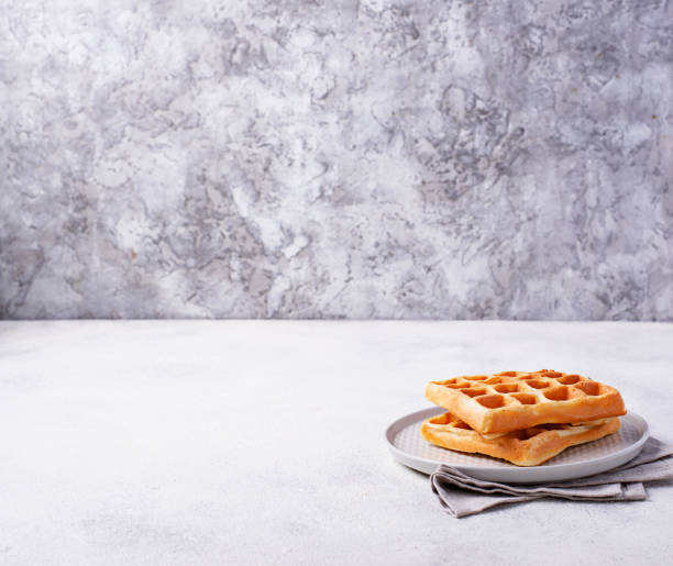 istock Waffles with strawberries and banana 1127579409