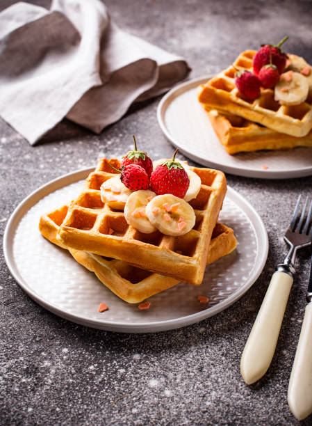 istock Waffles with strawberries and banana 1127579438