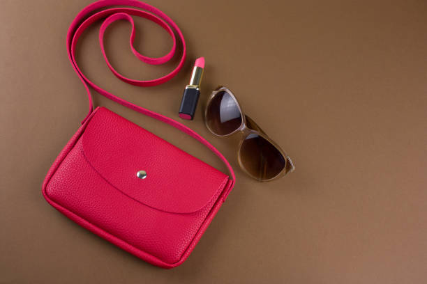 istock top view fashion flat lay with red bag 1127579710