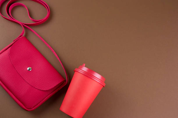 istock top view fashion flat lay with red bag 1127579891