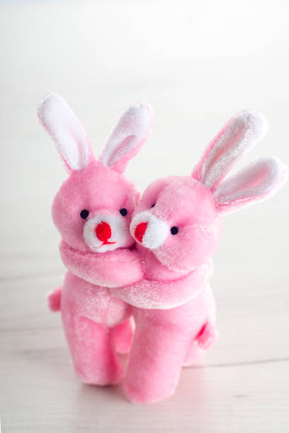 istock Pink toy bunnies hugging in valentines day 1127580702