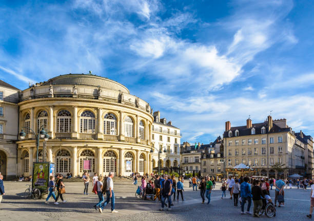 Opera house on the town hall square in Rennes, France. Rennes, France - October 13, 2018: People strolling on the pedestrian town hall square in front of the rounded facade of the opera house by a sunny saturday afternoon under a deep blue sky. brittany france photos stock pictures, royalty-free photos & images