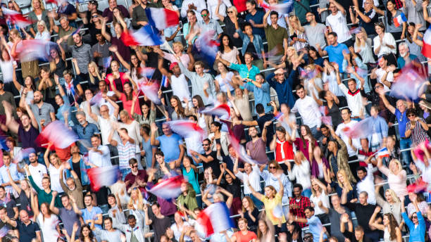 istock French fans waving their flags on a stadium 1127582230
