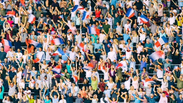 istock Crowds on a stadium with French flags 1127582252