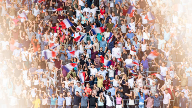 istock French fans waving their flags on a stadium 1127582269