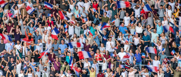 istock Crowds on a stadium with French flags 1127582275