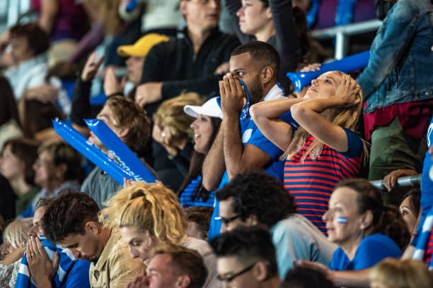istock Desperate fans holding their heads on a stadium 1127582552
