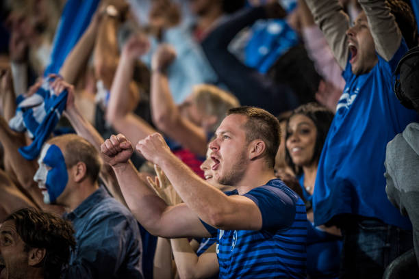 istock Crowd celebrating after team success 1127582556