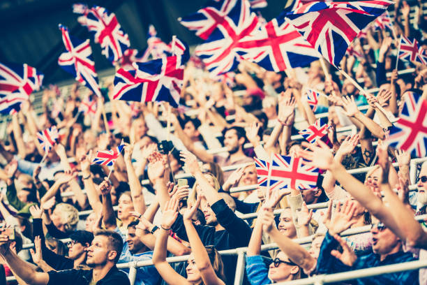 istock Great Britain fans waving flags on a stadium 1127582890