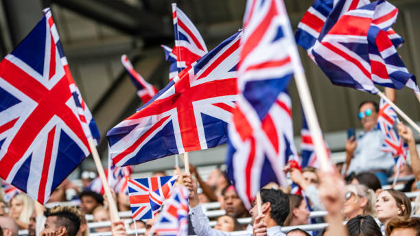 istock Great Britain fans waving their flags 1127582892