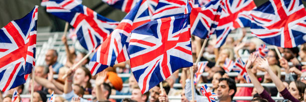 istock Great Britain fans waving their flags 1127582895