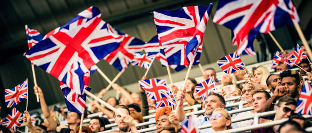 istock Great Britain sports fans waving their flags 1127582896