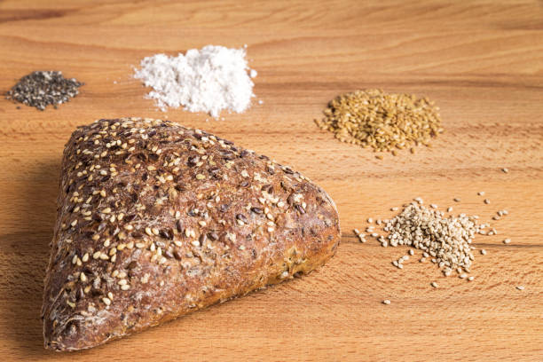 istock Integral bread in the form of a triangle with linseed, oats and sesame seeds 1127583740
