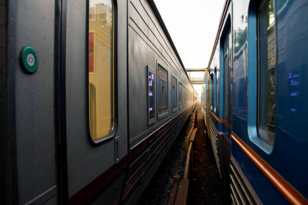 istock Abstract of two train side by side with rail 1127585382