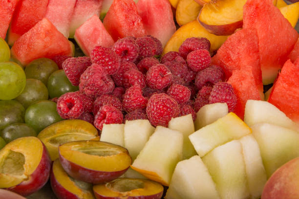 istock Fruit mix. Peach, grape, apple, watermelon, melon, raspberry, plum, close-up 1127586569