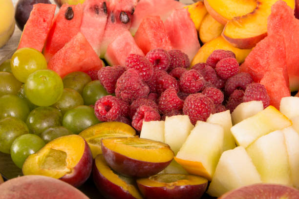 istock Fruit mix. Peach, grape, apple, watermelon, melon, raspberry, plum, close-up 1127586570