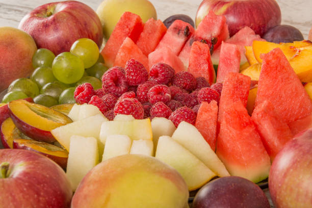 istock Fruit mix. Peach, grape, apple, watermelon, melon, raspberry, plum, close-up 1127586588
