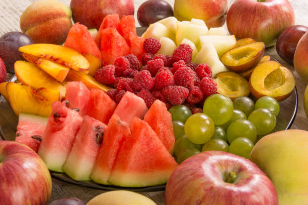 istock Fruit mix. Peach, grape, apple, watermelon, melon, raspberry, plum, close-up 1127586619