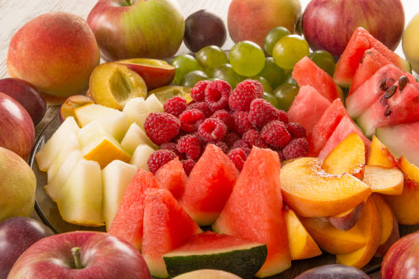 istock Fruit mix. Peach, grape, apple, watermelon, melon, raspberry, plum, close-up 1127586620