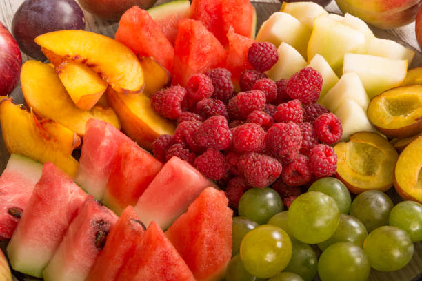 istock Fruit mix. Peach, grape, apple, watermelon, melon, raspberry, plum, close-up 1127586637