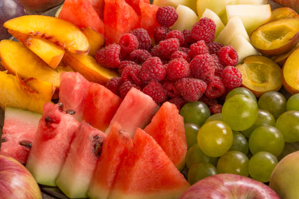 istock Fruit mix. Peach, grape, apple, watermelon, melon, raspberry, plum, close-up 1127586638