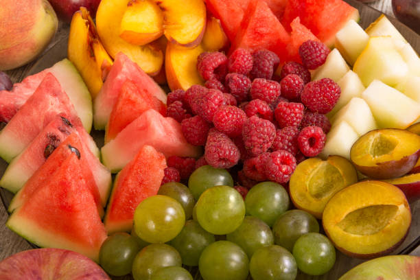 istock Fruit mix. Peach, grape, apple, watermelon, melon, raspberry, plum, close-up 1127586689
