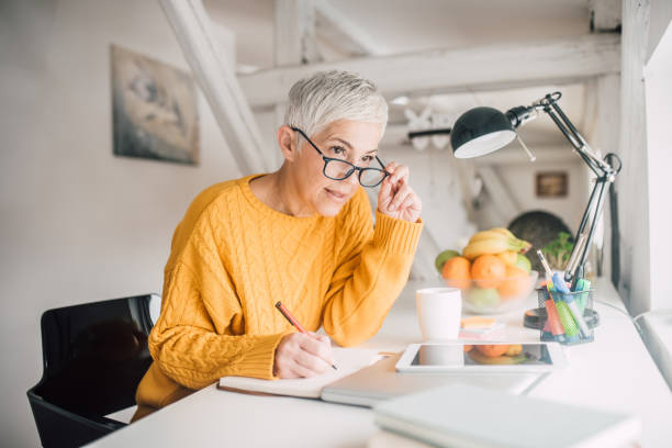 istock Woman holding eyeglasses 1127591011