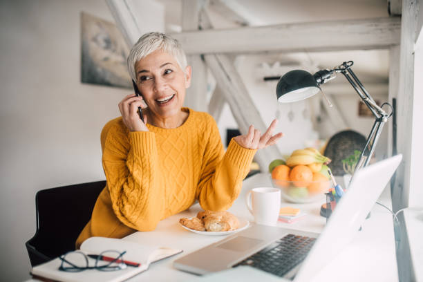 istock Happy woman talking on phone 1127591248