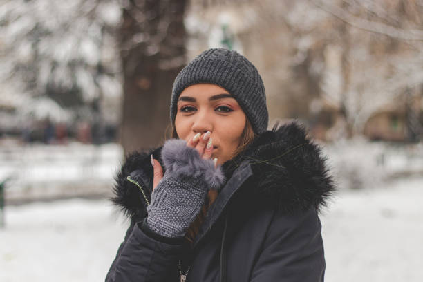 istock Charming woman sending kiss 1127591399