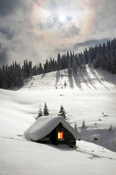 beautiful cabins in the Rocky Mountains of Canada. Snow covered the ground.