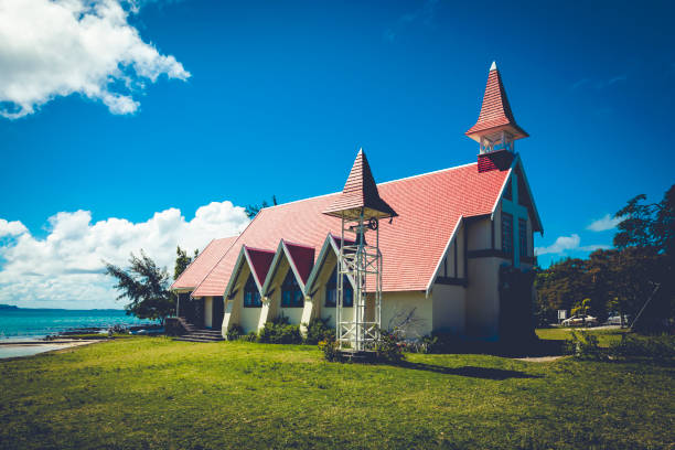 landmarks of mauritius island - red church on the beach at cap malheureux, mauritius island, mascarene islands in africa.