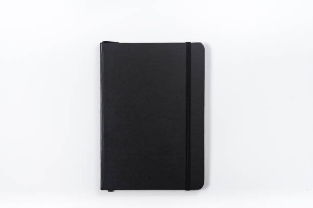 concetto aziendale - collezione top view di notebook nero su scrivania di sfondo bianca per il mockup - personal data assistant foto e immagini stock