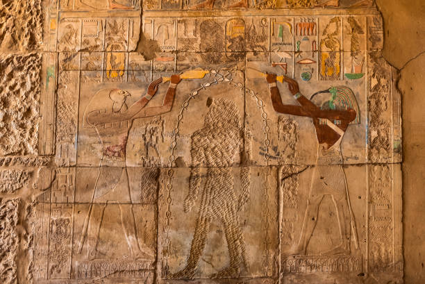istock Ancient egyptian wall-painting and hieroglyphs at Karnak temple 1127596339