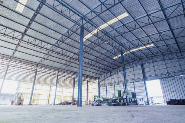 istock Factory building or warehouse building with concrete floor for background. 1127597513