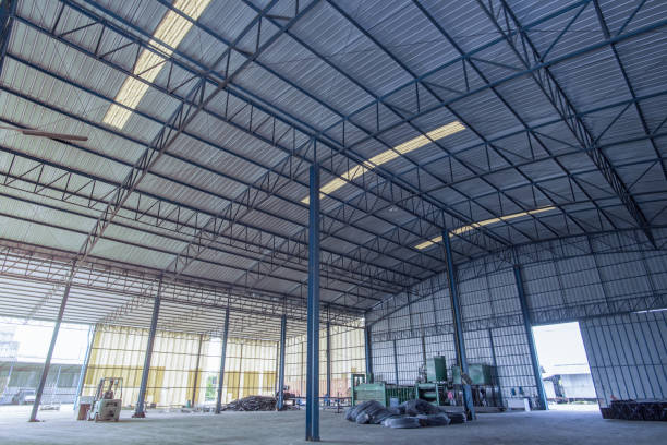 istock Factory building or warehouse building with concrete floor for background. 1127597531