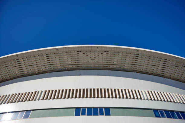 istock Modern Building with Glass Facade over Blue Sky 1127597950