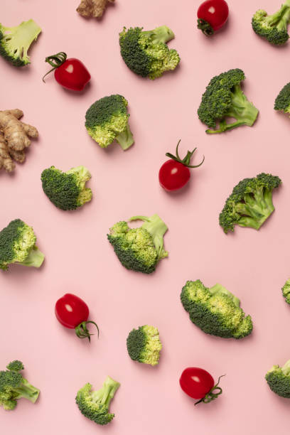 istock Colorful pattern of tomatoes, broccoli, ginger on a pink background 1127599092