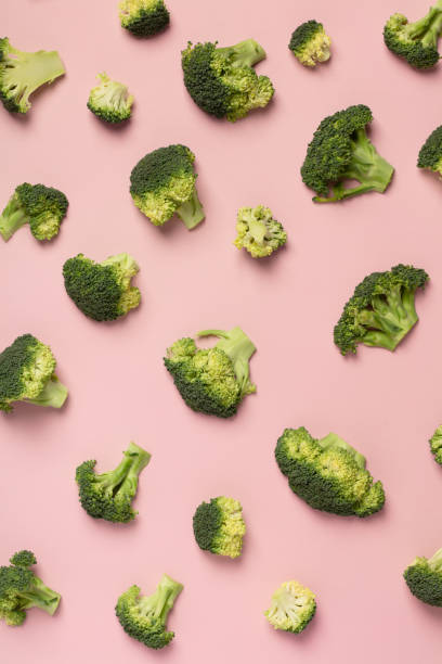 istock Colorful pattern of broccoli on a pink background 1127599096