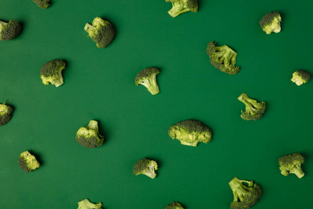 istock Colorful pattern of Broccoli on a green background. 1127599103