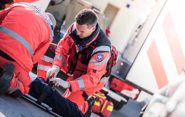 istock Rescue Team Helping Victim Of Car Crash 1127601207