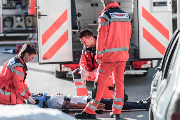 istock Rescue Team Helping Victim Of Car Crash 1127601225