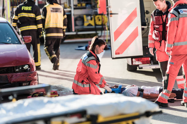 istock Rescue Team Helping Victim Of Car Crash 1127601228